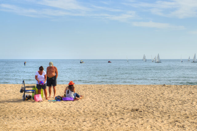 Summer Apartment Living Chicago View of family setting up on North Avenue beach