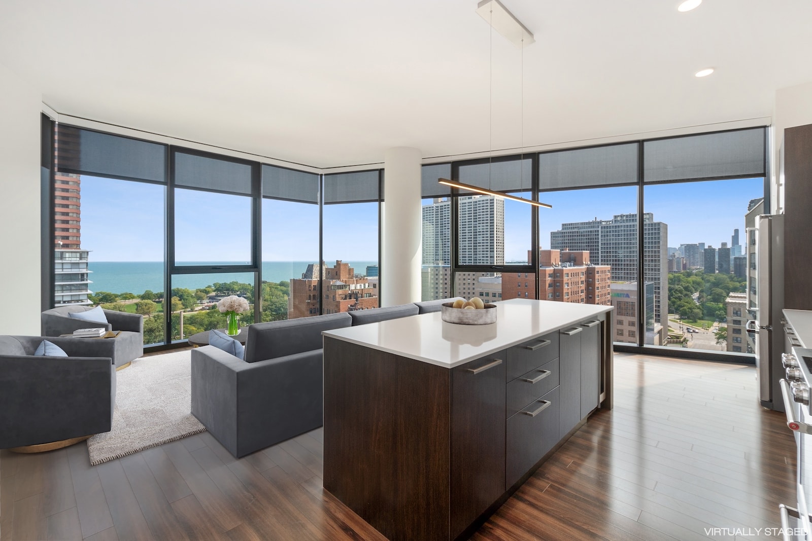 A cozy living room with large windows In Lakevview, modern furnishings, and natural light streaming in, creating a warm and inviting atmosphere.