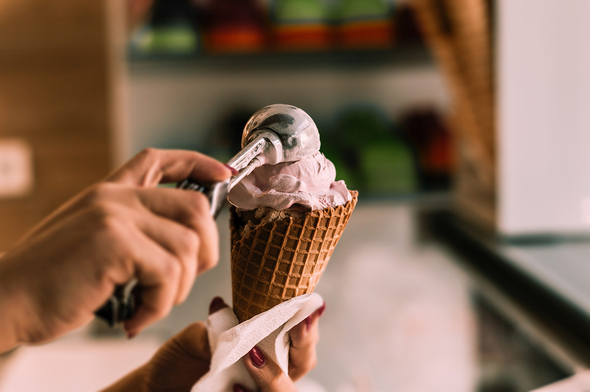 Woman scooping ice cream